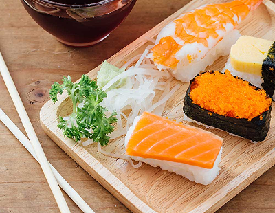 sushi set on wooden table with healthy water pkmhz2e 1
